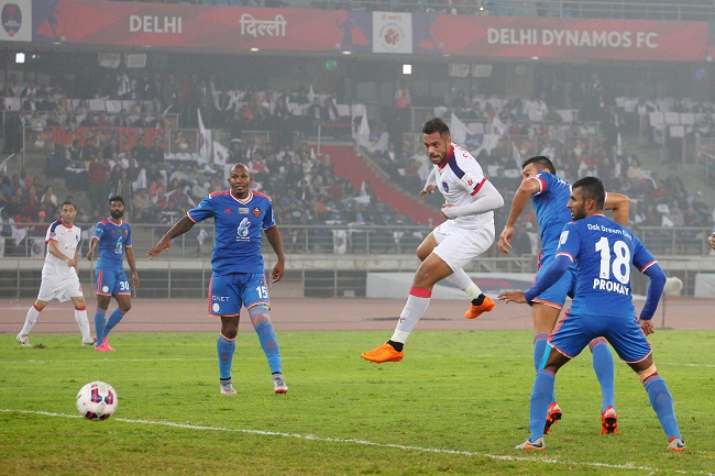 Robin Singh of Delhi Dynamos FC heads the ball to score the opening goal