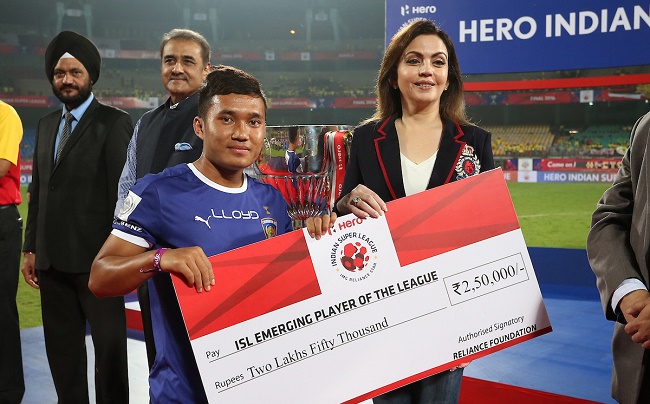 Jerry Lalrinzuala of Chennaiyin FC receives the ISL Emerging Player of the League Award from Nita Ambani Founder & Chairperson of Football Sports Development during the penalty shoot out of the Final of the Indian Super League (ISL) season 3 between Kerala Blasters FC and Atletico de Kolkata held at the Jawaharlal Nehru Stadium in Kochi, India on the 18th December 2016.