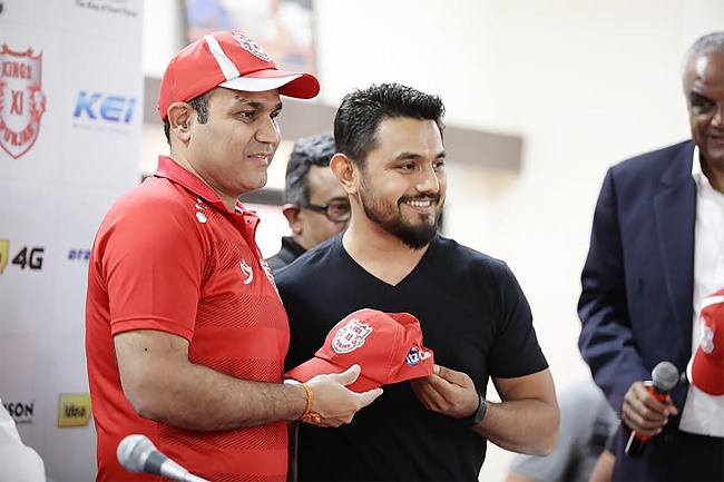 Virendra Sehwag and Bhavik Vasa (ItzCash) unveiling ItzCash branded cap for Kings XI Punjab team