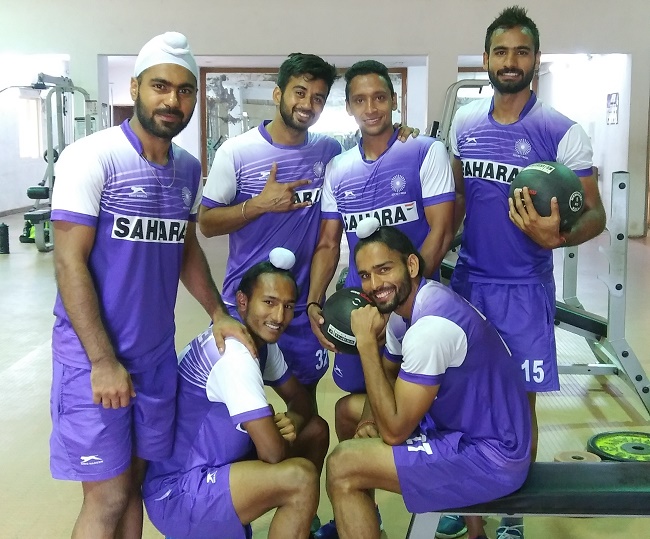 Manpreet Singh along with teammates