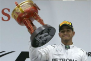 China unhappy with Lewis spraying champagne on presenters