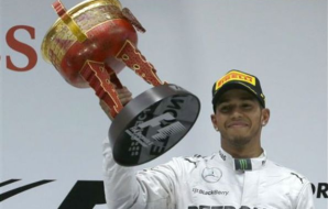 China unhappy with Lewis spraying champagne on presenters