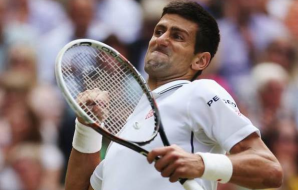 Novak beats Federer; almost loses eye while celebrating